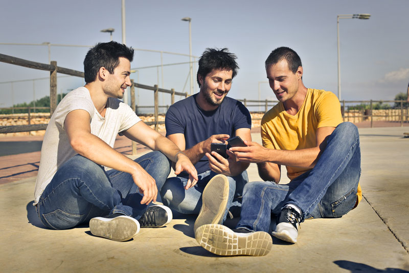 Men sitting down on the ground