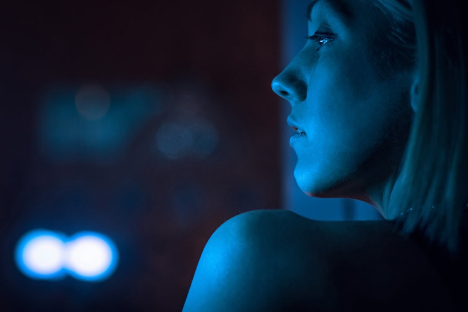 Sideview of a woman's face at night